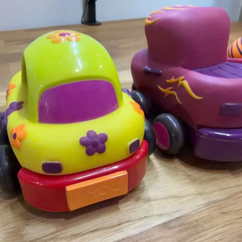 B. Toys Pull Back Trucks Taxi Cab Convertible Lot of 4 Flower Car Play Imaginati